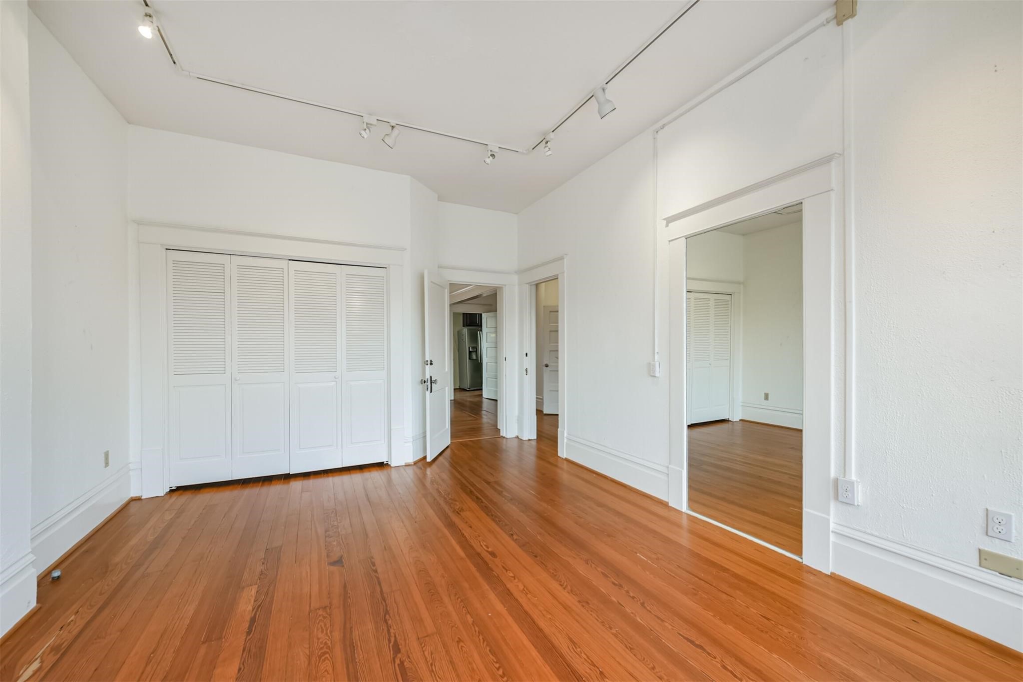 239 Westheimer Road Houston, TX 77006 - Photo 24 of 50 SECOND FLOOR: A different perspective showcases the primary suite’s seamless layout, featuring a spacious closet and convenient access to the adjoining flex room.
