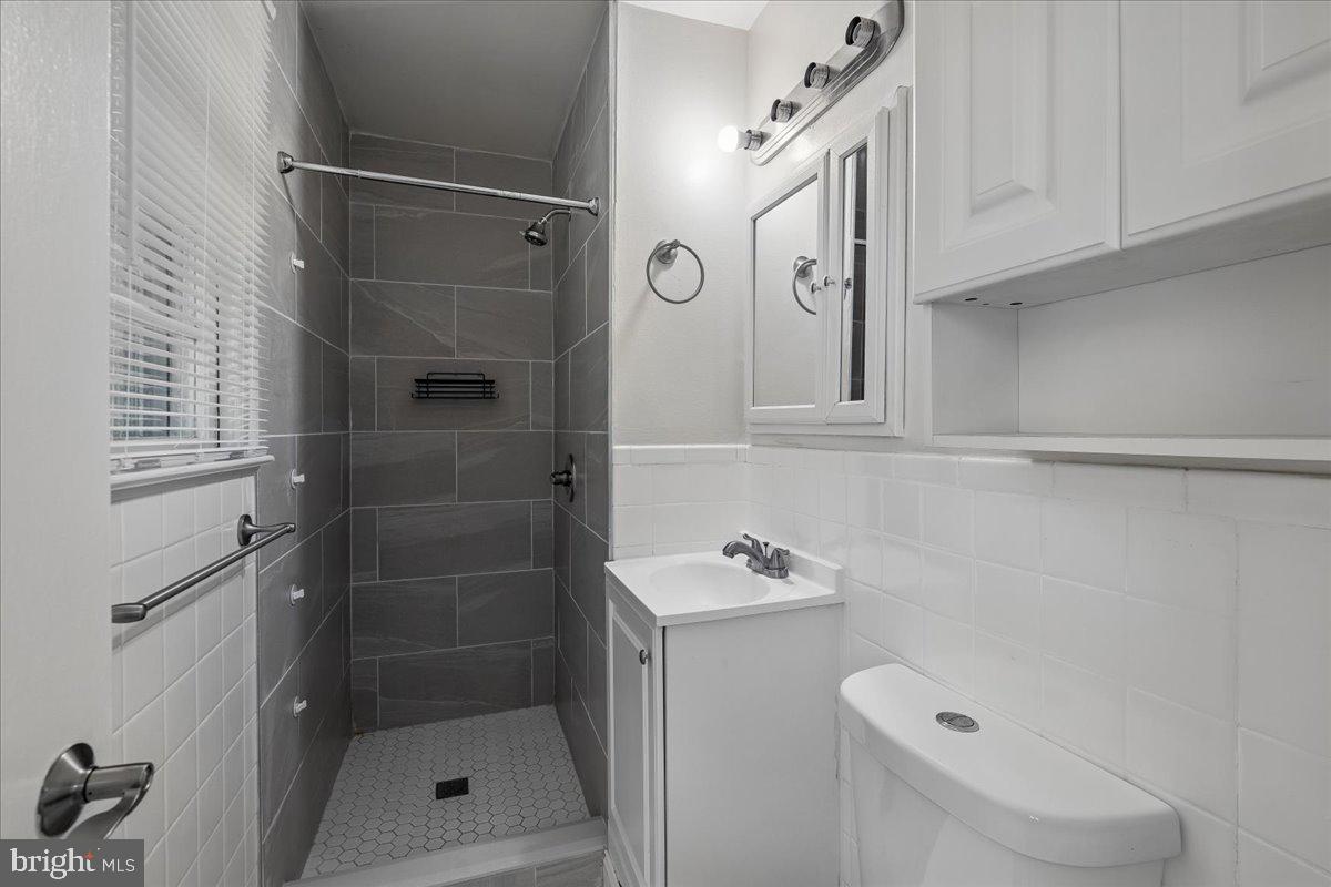 13012 Georgia Avenue Silver Spring, MD 20906 - Photo 13 of 31 Sleek modern bathroom retreat.