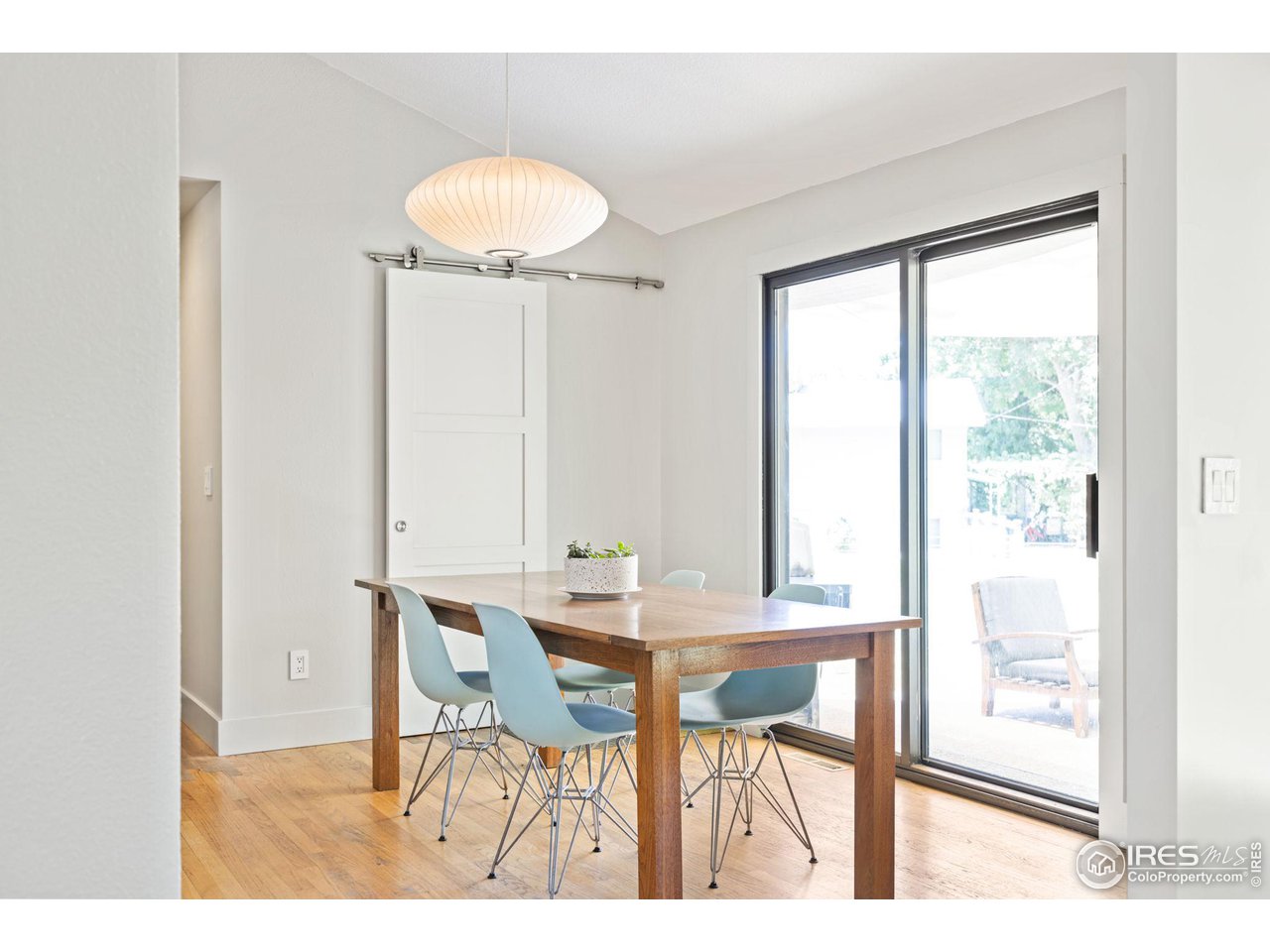 7705 Baseline Road Boulder, CO 80303 - Photo 11 of 40 a view of a dining room with furniture and a chandelier