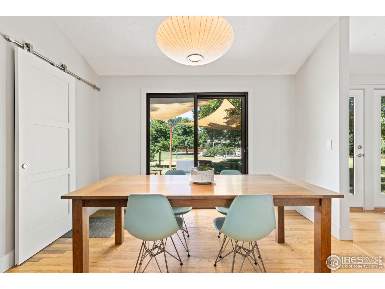 7705 Baseline Road Boulder, CO 80303 - Photo 12 of 40 a view of a dining room with furniture and a window