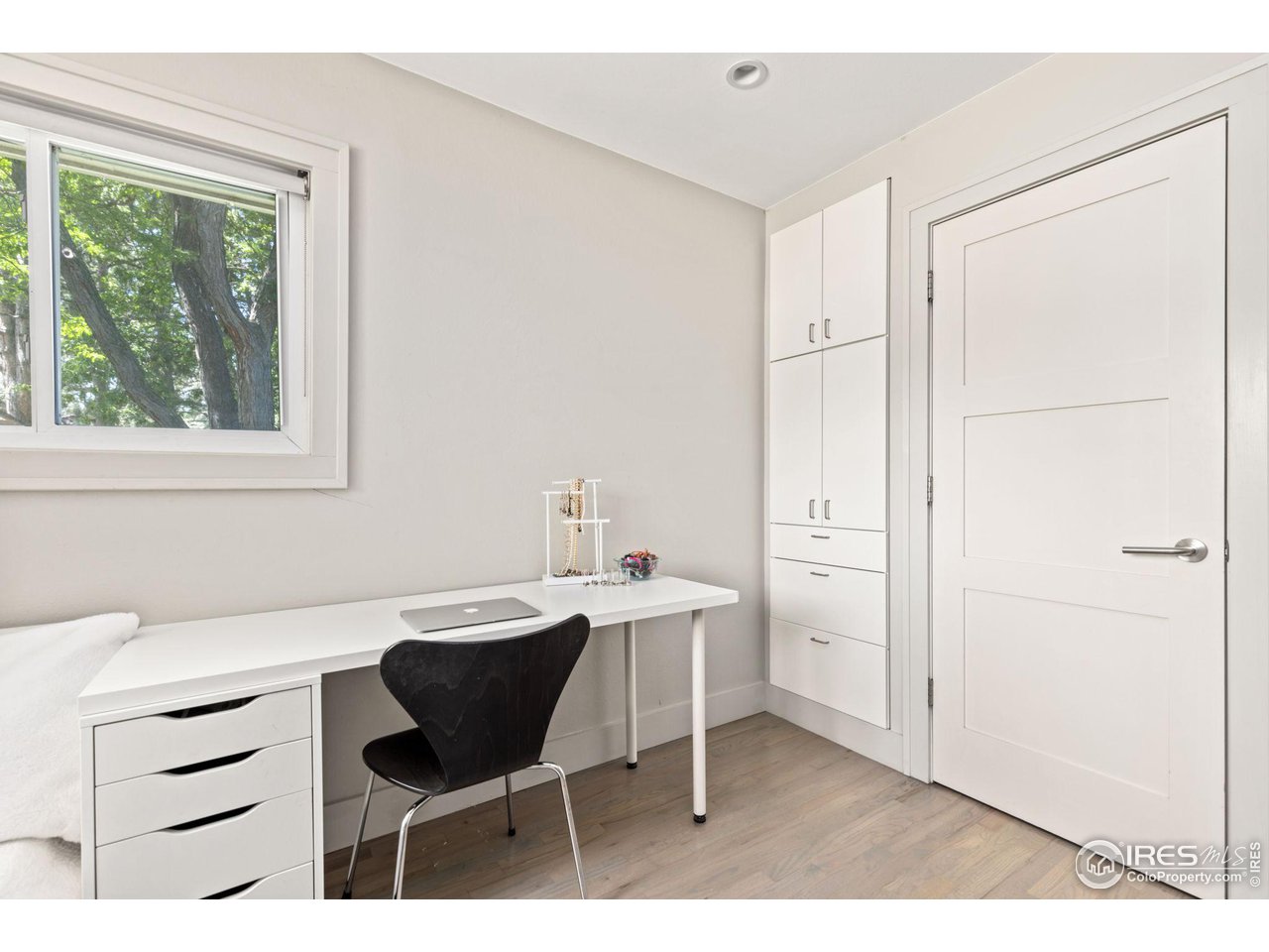 7705 Baseline Road Boulder, CO 80303 - Photo 17 of 40 a kitchen with a sink cabinets and dining table