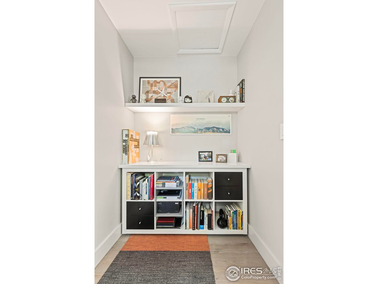 7705 Baseline Road Boulder, CO 80303 - Photo 19 of 40 a living room with white cabinets and window