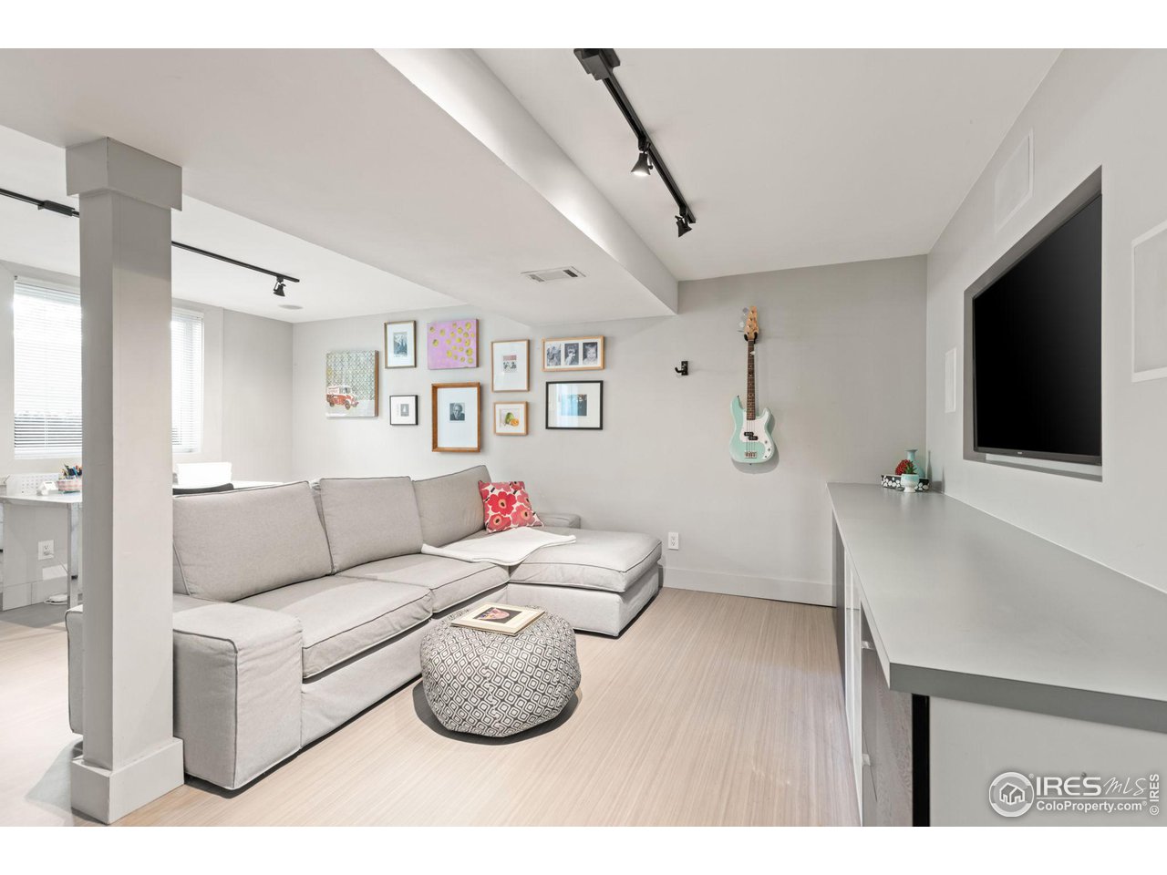 7705 Baseline Road Boulder, CO 80303 - Photo 25 of 40 a living room with furniture and a flat screen tv