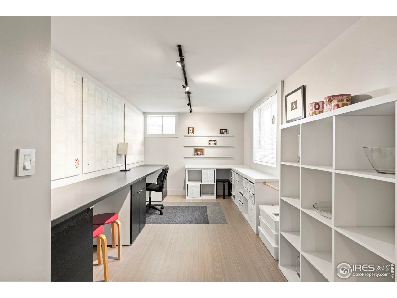 7705 Baseline Road Boulder, CO 80303 - Photo 27 of 40 a open kitchen with kitchen island a stove a sink dishwasher and a refrigerator with wooden floor
