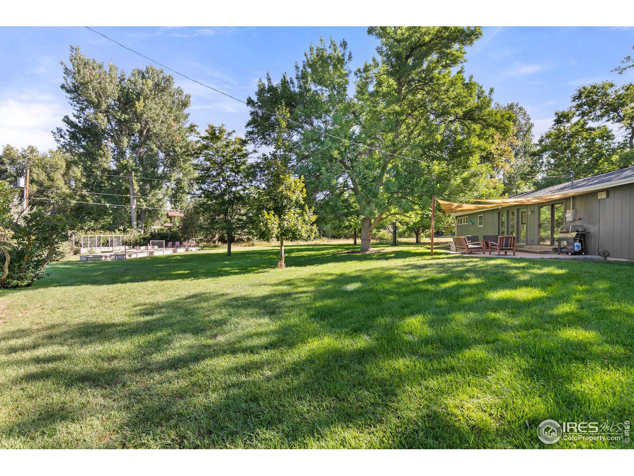 7705 Baseline Road Boulder, CO 80303 - Photo 29 of 40 a view of a house with a big yard