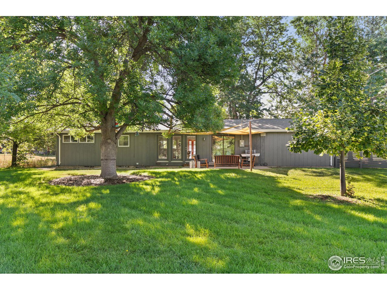 7705 Baseline Road Boulder, CO 80303 - Photo 32 of 40 a view of a house with a backyard