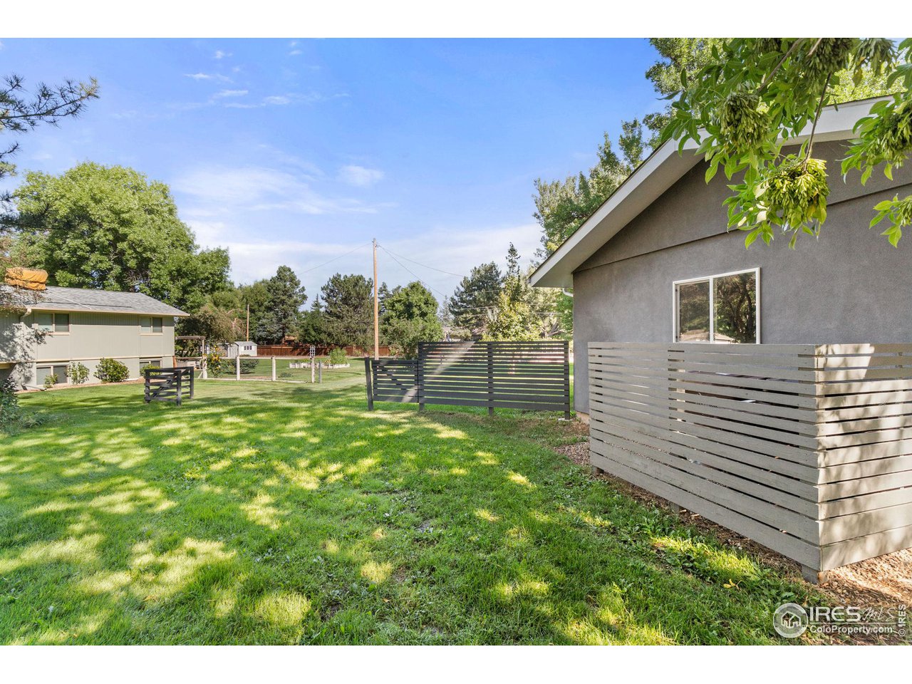 7705 Baseline Road Boulder, CO 80303 - Photo 37 of 40 a backyard of a house with plants and large tree