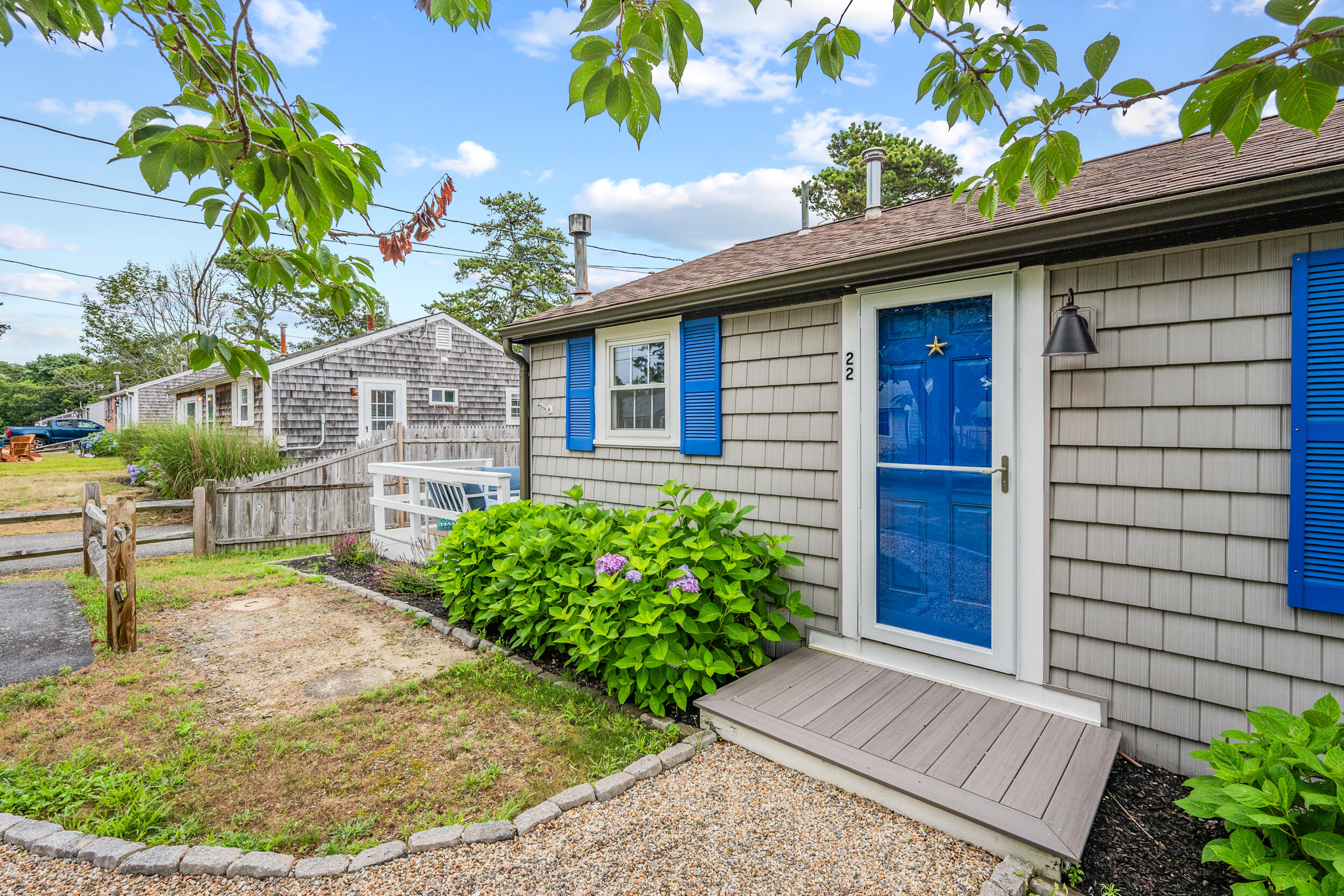 a view of a house with a small yard