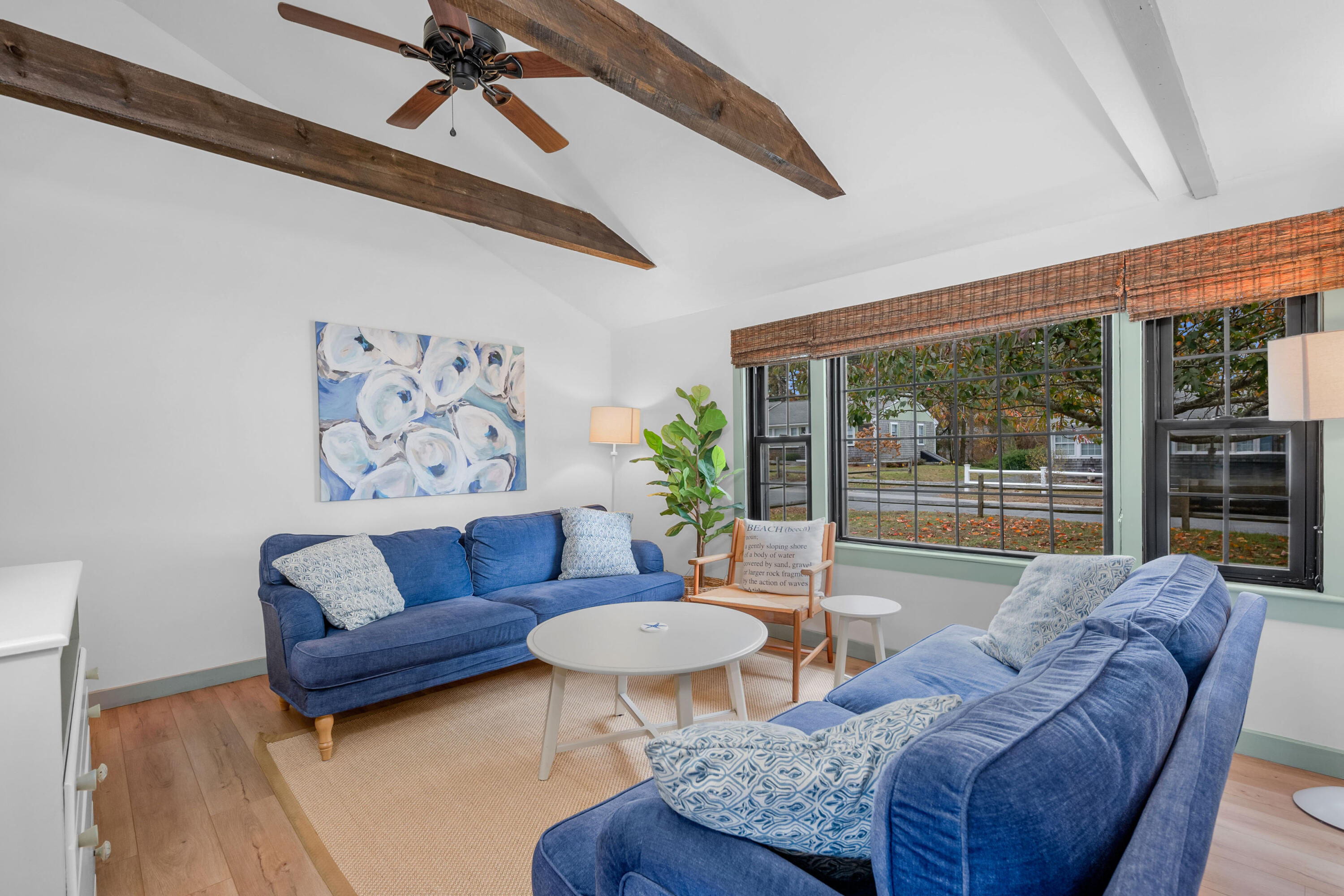 22 Wixon Road Dennis Port, MA 02639 - Photo 11 of 28 a living room with furniture and a large window