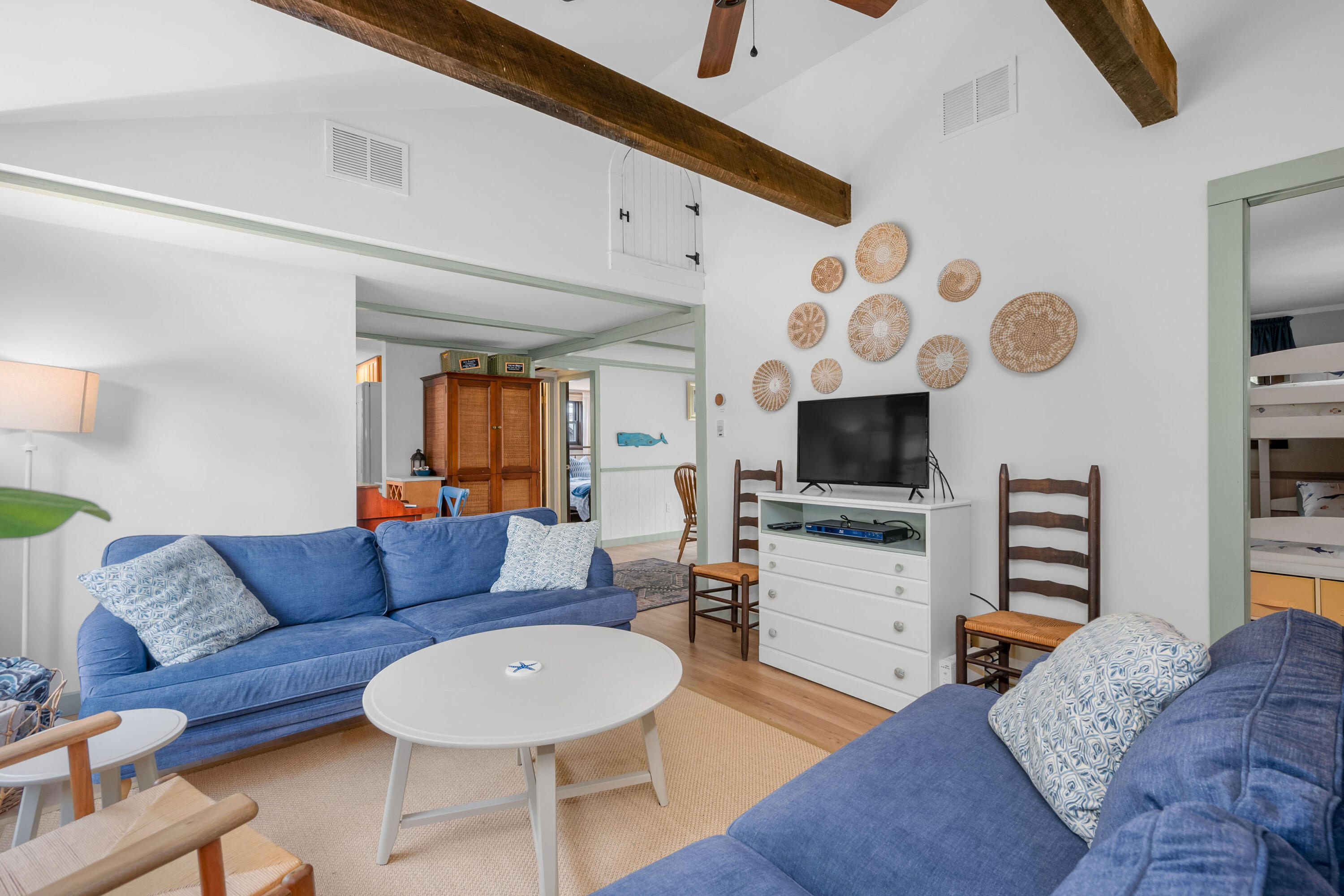 22 Wixon Road Dennis Port, MA 02639 - Photo 12 of 28 a living room with furniture and a flat screen tv