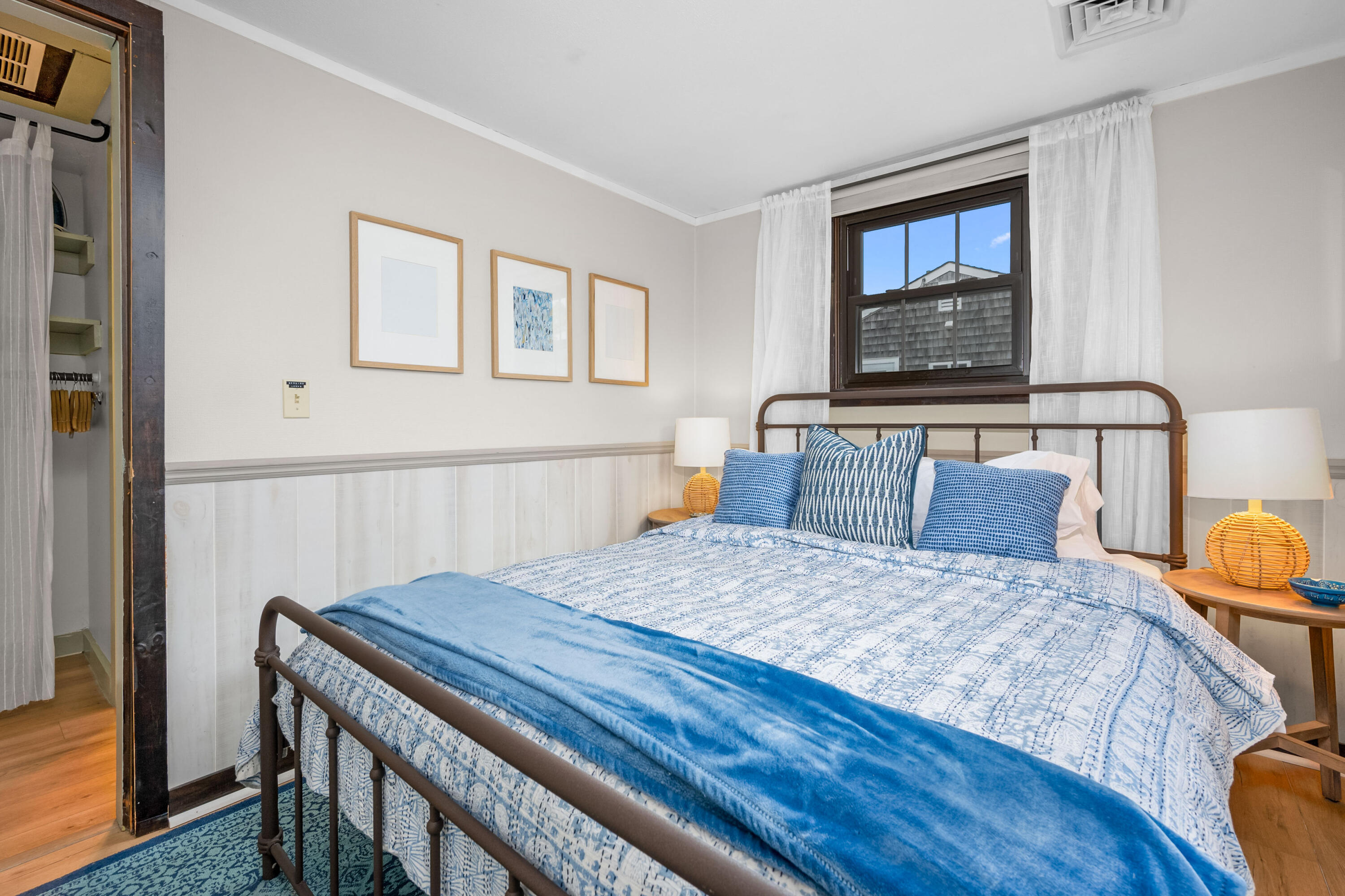 22 Wixon Road Dennis Port, MA 02639 - Photo 20 of 28 a bedroom with a bed a mirror and a flat screen tv