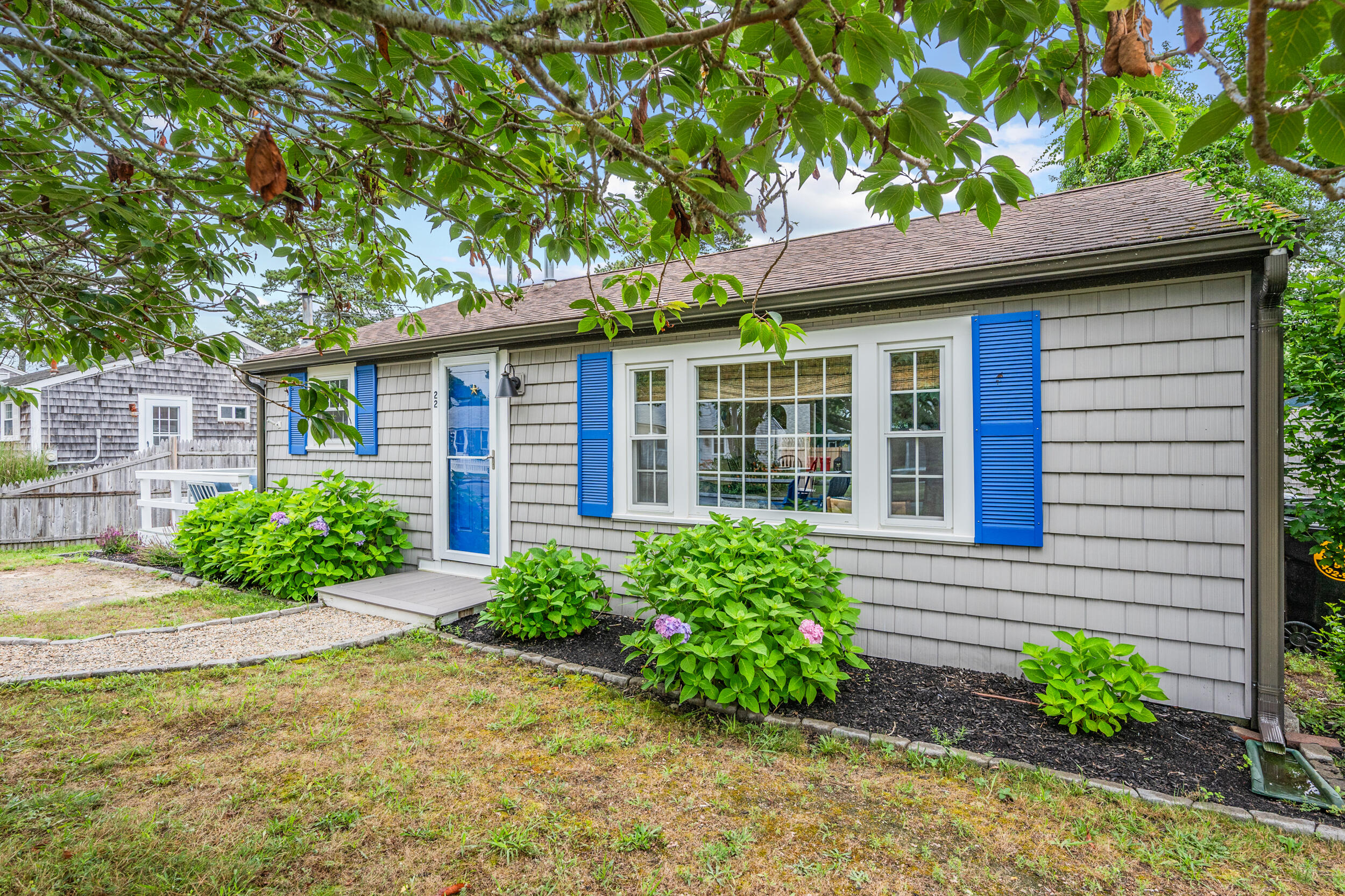 22 Wixon Road Dennis Port, MA 02639 - Photo 2 of 28 a front view of a house with garden