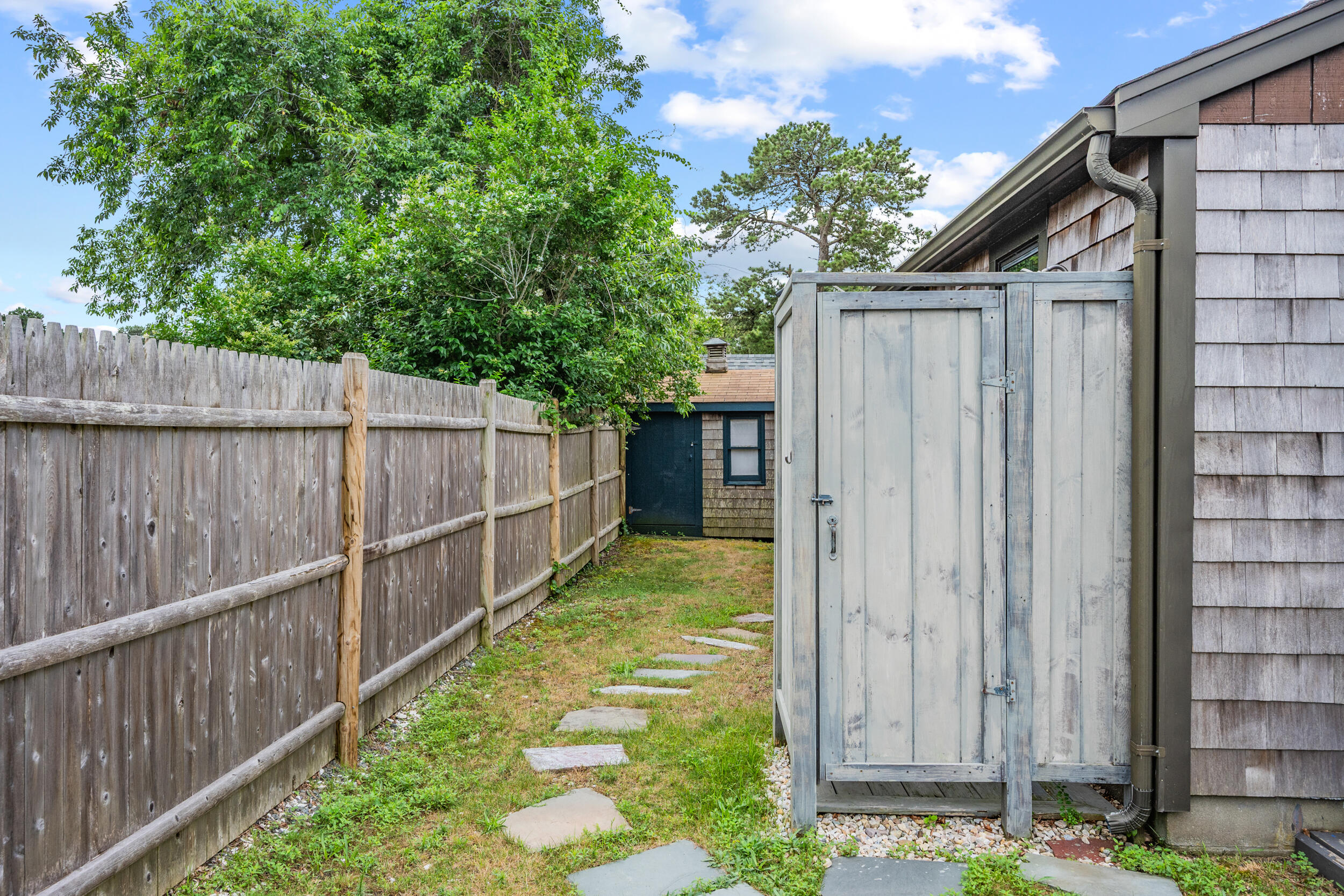 22 Wixon Road Dennis Port, MA 02639 - Photo 24 of 28 a view of a backyard with wooden fence