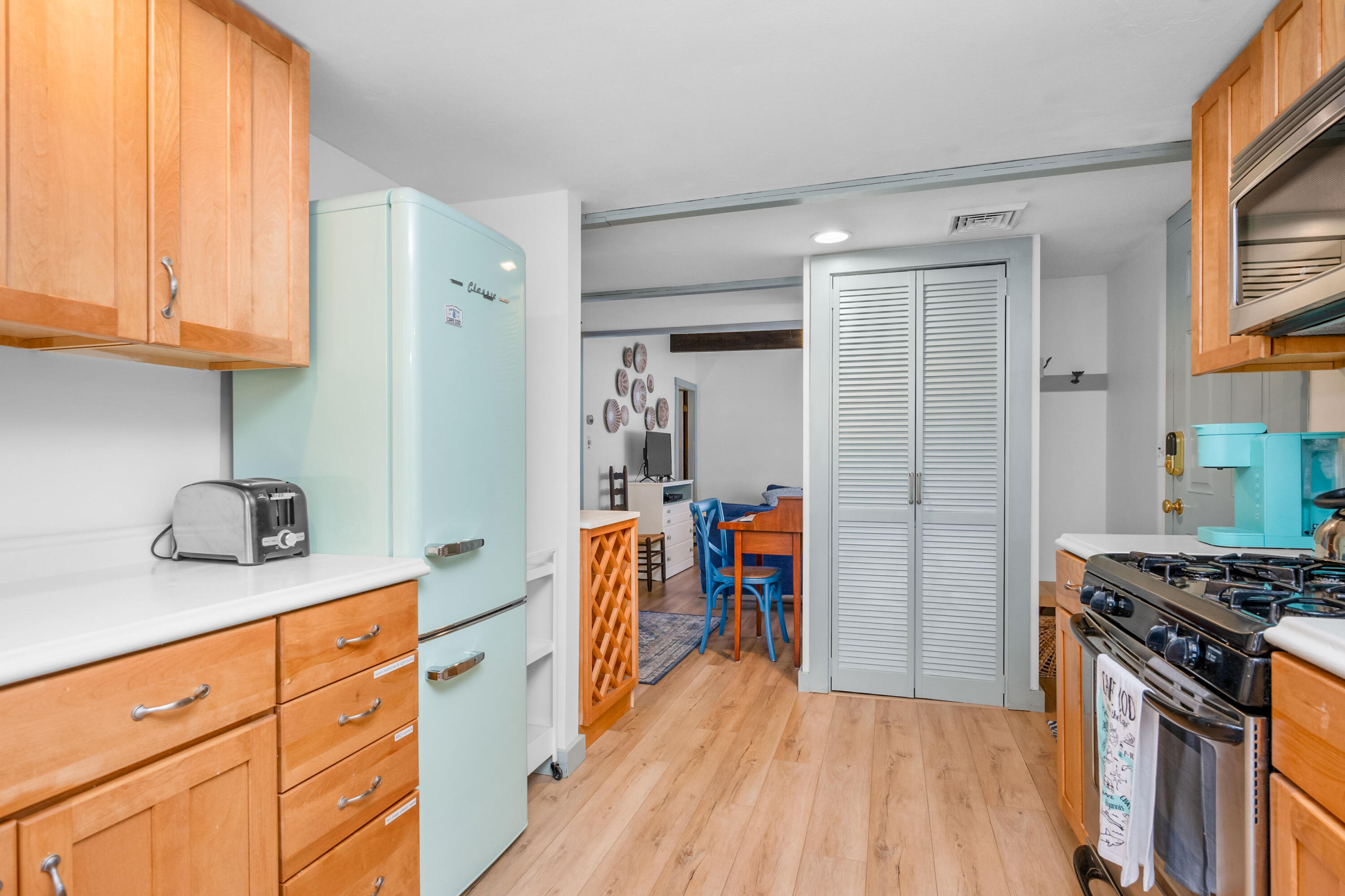 22 Wixon Road Dennis Port, MA 02639 - Photo 9 of 28 a kitchen with stainless steel appliances granite countertop a stove a sink dishwasher and a refrigerator with wooden floor