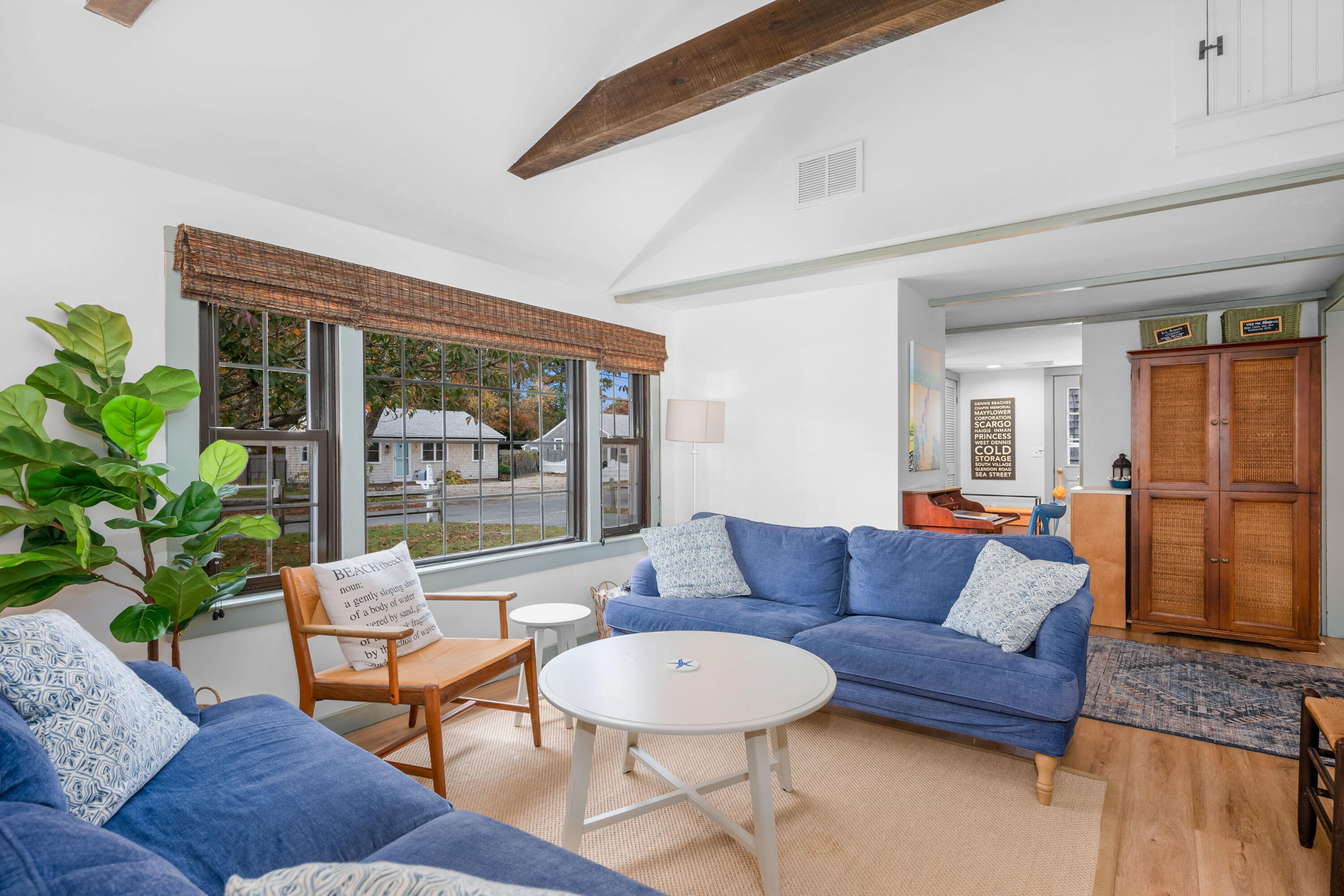 22 Wixon Road Dennis Port, MA 02639 - Photo 10 of 28 a living room with furniture and a large window