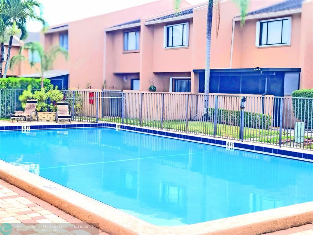139 Sparrow Drive, Unit 4B Royal Palm Beach, FL 33411 - Photo 24 of 48 a view of swimming pool with a lounge chairs