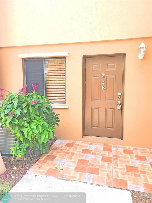 139 Sparrow Drive, Unit 4B Royal Palm Beach, FL 33411 - Photo 32 of 48 a front view of a house
