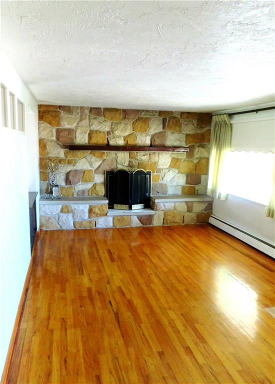 1076 Silver Lane McKees Rocks, PA 15136 - Photo 2 of 21 Livingroom (18X14) original hardwood floors & custom fire place.