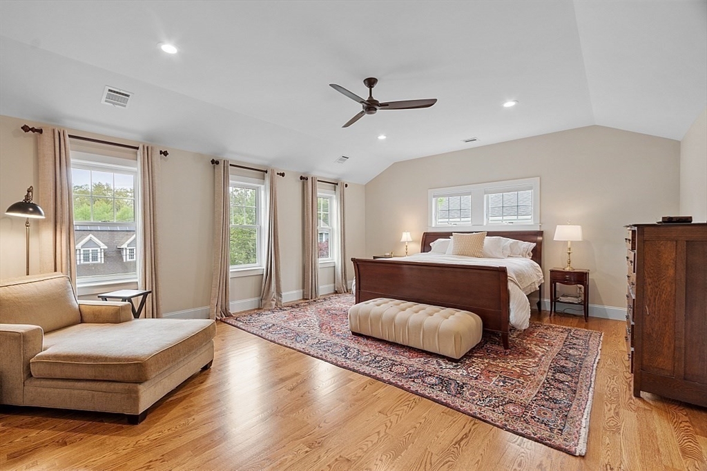 63 Thornton Road Needham, MA 02492 - Photo 19 of 41 a bedroom with a large bed a chandelier and windows