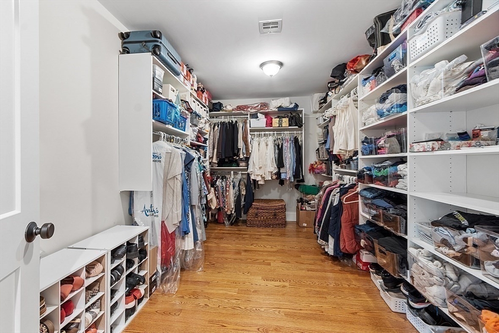 63 Thornton Road Needham, MA 02492 - Photo 23 of 41 a view of walk in closet with clothes and shoes