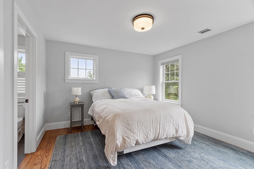 63 Thornton Road Needham, MA 02492 - Photo 24 of 41 a bedroom with a bed and a window