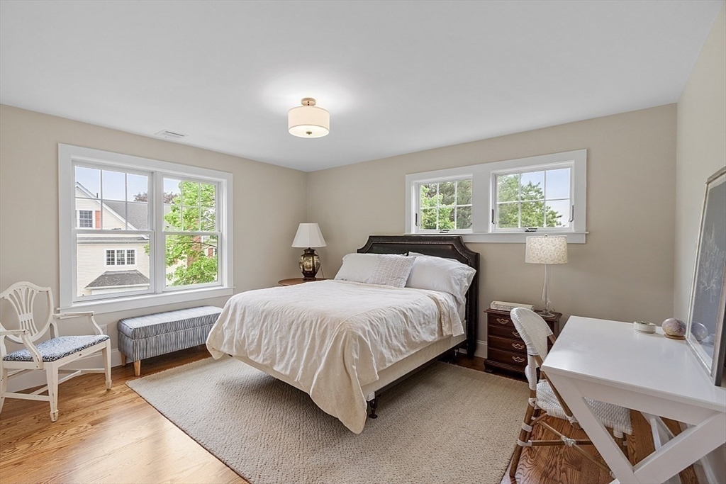 63 Thornton Road Needham, MA 02492 - Photo 27 of 41 a spacious bedroom with a bed and a window