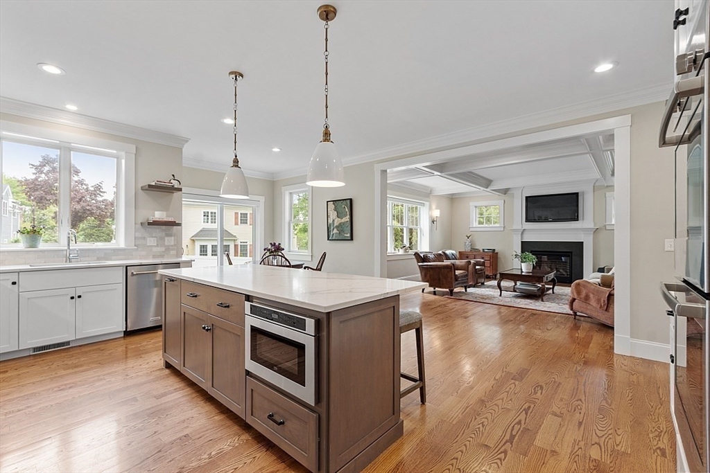 63 Thornton Road Needham, MA 02492 - Photo 7 of 41 a kitchen with stainless steel appliances granite countertop a stove and wooden floor