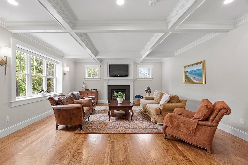 63 Thornton Road Needham, MA 02492 - Photo 10 of 41 a living room with furniture and a fireplace