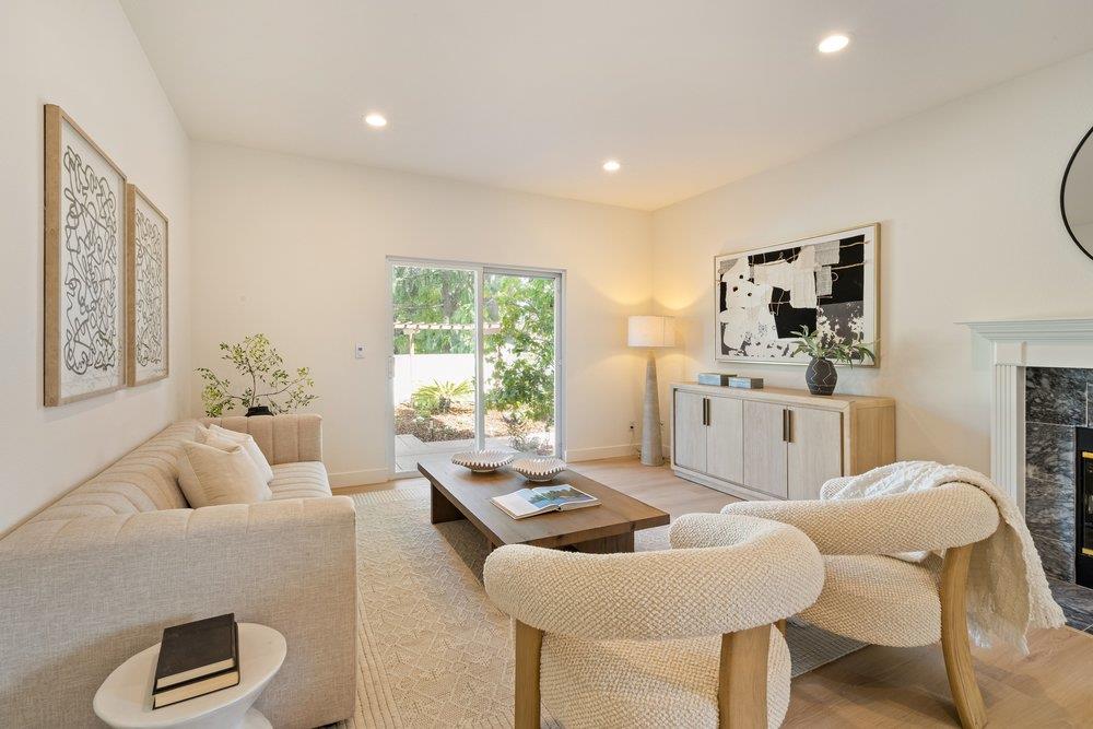 10496 South Stelling Road Cupertino, CA 95014 - Photo 12 of 54 a living room with furniture and a large window