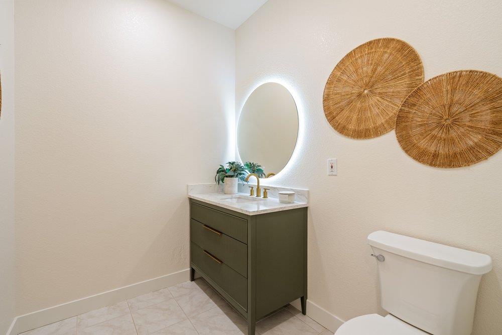 10496 South Stelling Road Cupertino, CA 95014 - Photo 19 of 54 a bathroom with a sink mirror and vanity