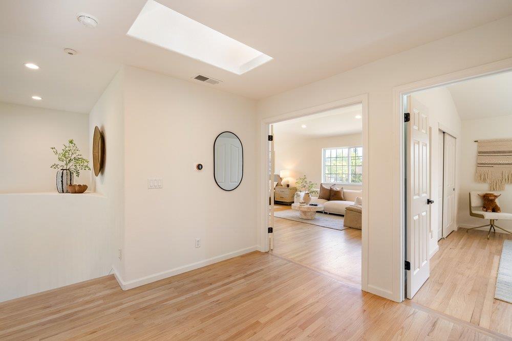 10496 South Stelling Road Cupertino, CA 95014 - Photo 22 of 54 a view of a living room and hardwood floor