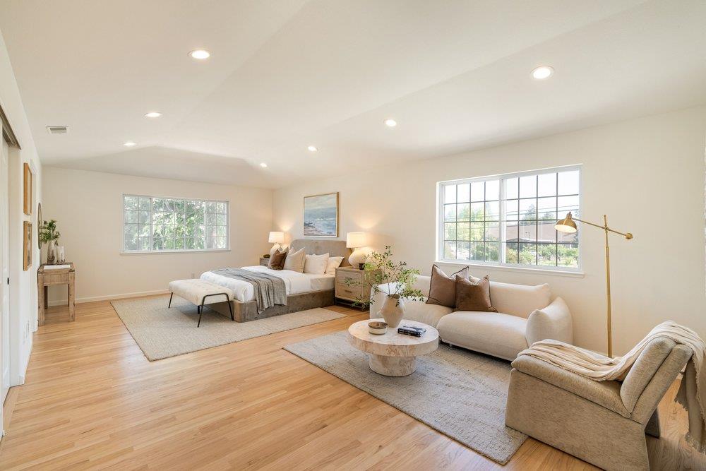 10496 South Stelling Road Cupertino, CA 95014 - Photo 23 of 54 a living room with furniture and a large window