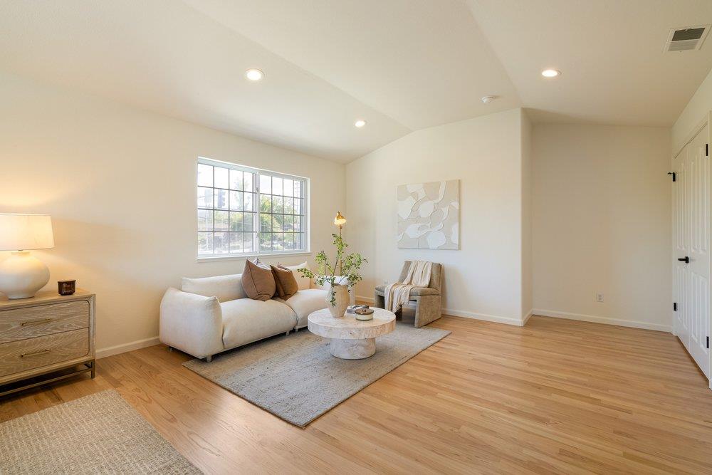 10496 South Stelling Road Cupertino, CA 95014 - Photo 24 of 54 a living room with furniture and a large window