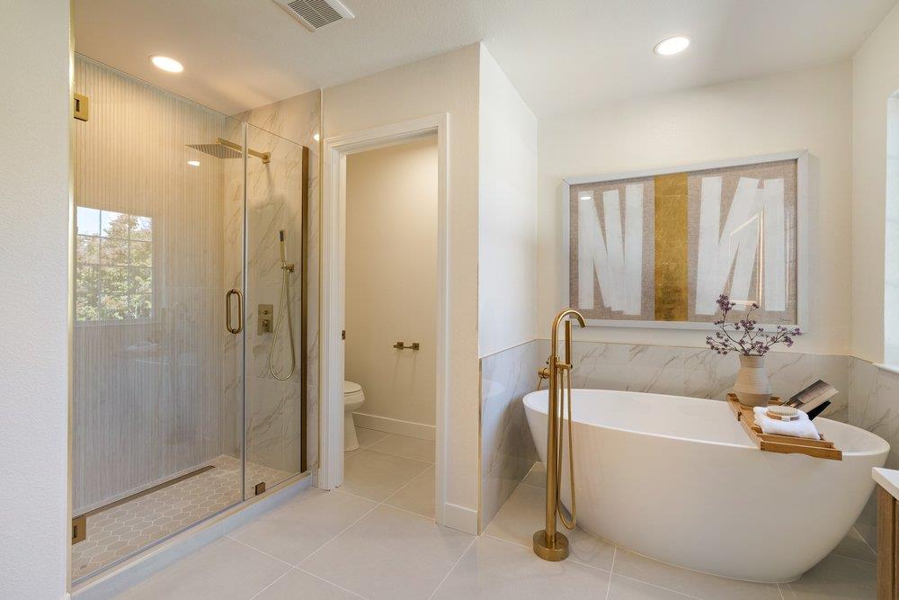 10496 South Stelling Road Cupertino, CA 95014 - Photo 28 of 54 a bathroom with a tub shower and sink