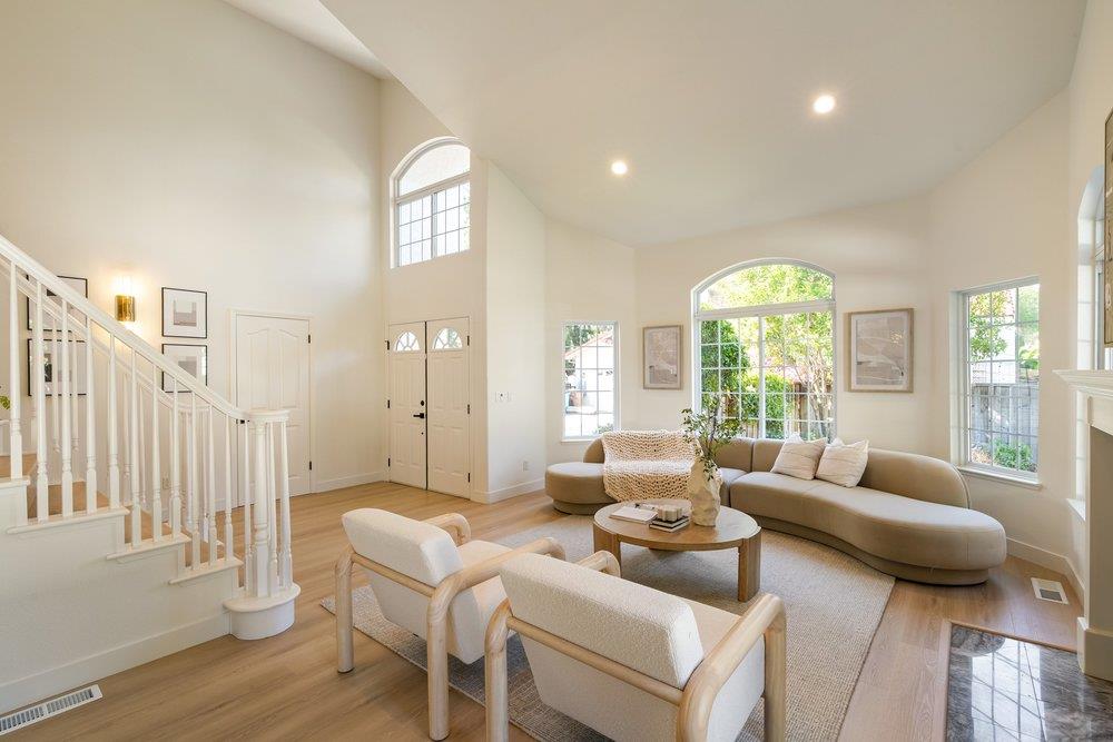 10496 South Stelling Road Cupertino, CA 95014 - Photo 3 of 54 a living room with furniture and a large window