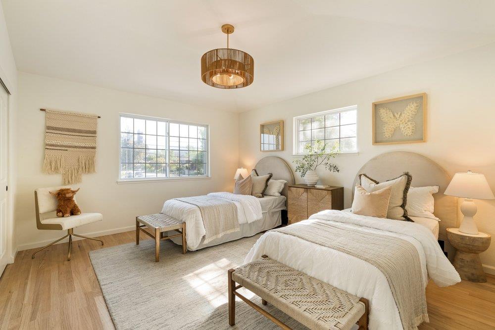 10496 South Stelling Road Cupertino, CA 95014 - Photo 31 of 54 a spacious bedroom with two beds and a chair