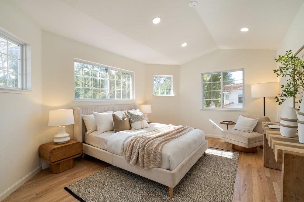 10496 South Stelling Road Cupertino, CA 95014 - Photo 35 of 54 a bedroom with a bed and wooden floor
