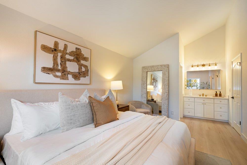 10496 South Stelling Road Cupertino, CA 95014 - Photo 40 of 54 a spacious bedroom with a bed and a large mirror