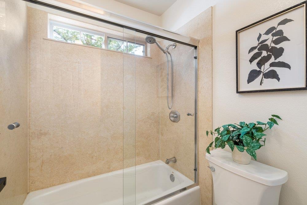 10496 South Stelling Road Cupertino, CA 95014 - Photo 42 of 54 a bath room with a toilet and a shower curtain