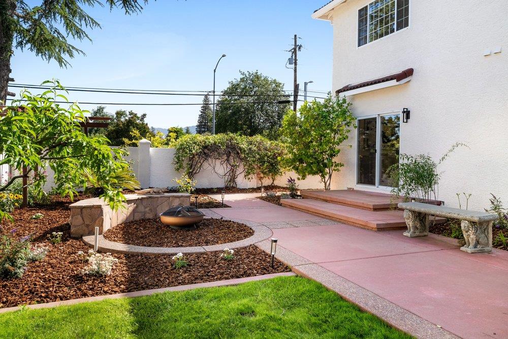10496 South Stelling Road Cupertino, CA 95014 - Photo 45 of 54 a view of a backyard with plants and a fountain