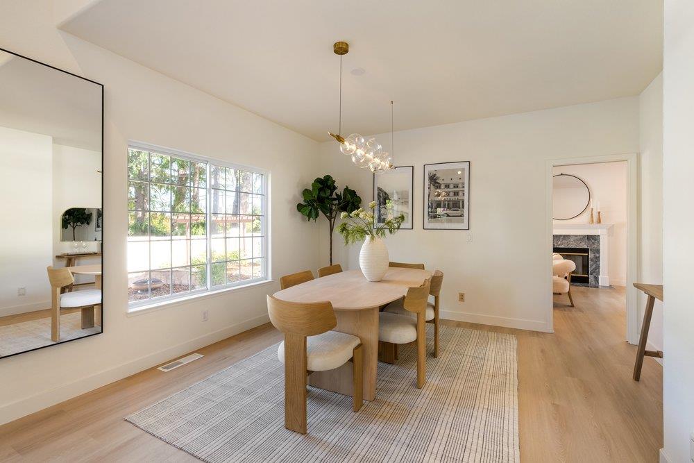 10496 South Stelling Road Cupertino, CA 95014 - Photo 7 of 54 a view of a dining room with furniture window and wooden floor