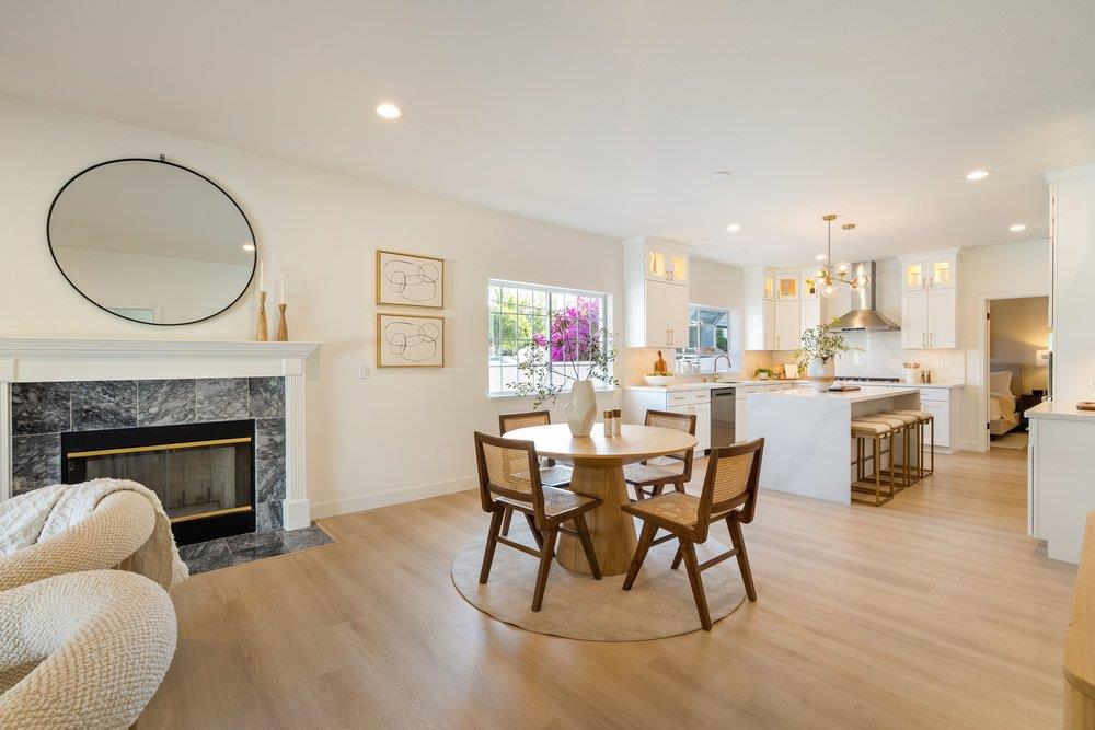 10496 South Stelling Road Cupertino, CA 95014 - Photo 8 of 54 a dining room with furniture and a fireplace