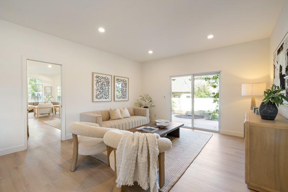 10496 South Stelling Road Cupertino, CA 95014 - Photo 10 of 54 a living room with furniture and a large window
