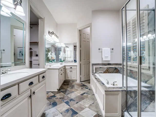 a large white kitchen with a large window