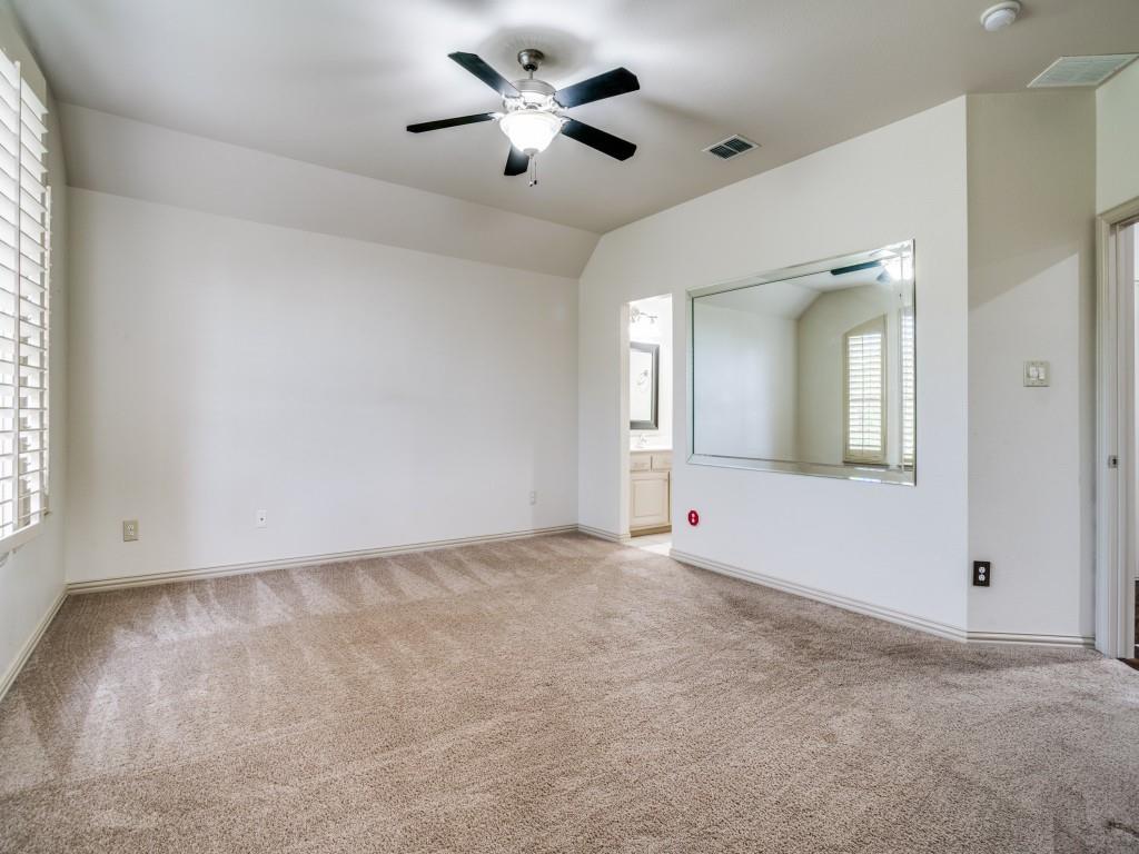 1908 Bordeaux Court Allen, TX 75002 - Photo 18 of 28 an empty room with chandelier fan and windows