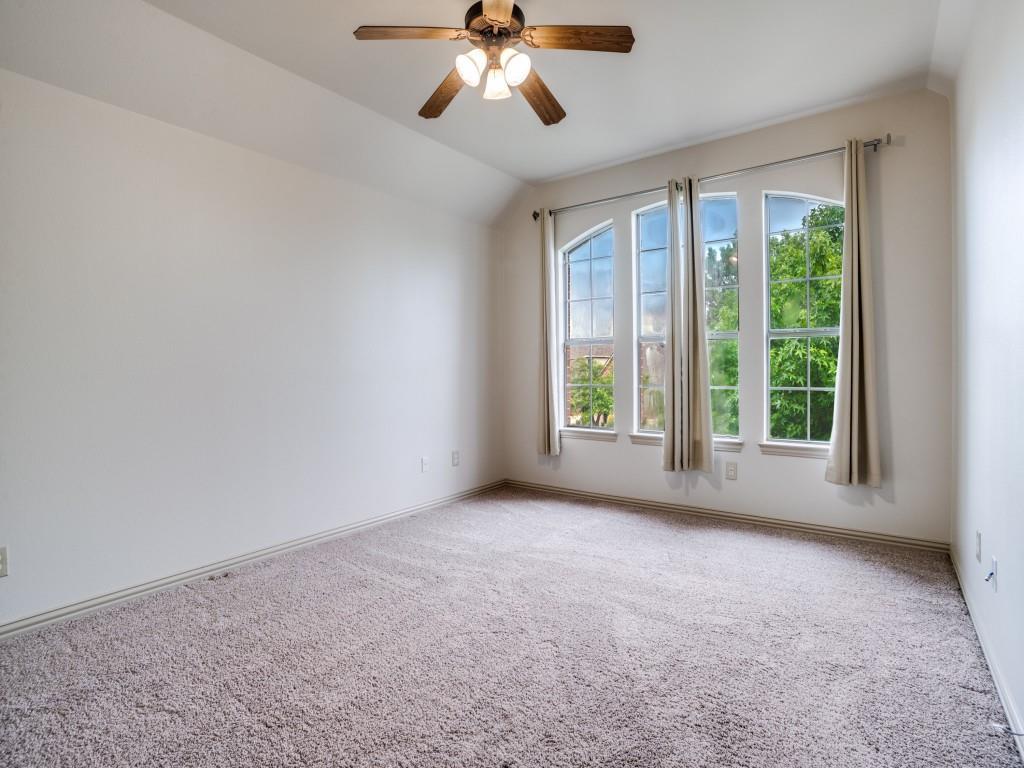 1908 Bordeaux Court Allen, TX 75002 - Photo 21 of 28 a view of a big room with windows and chandelier fan