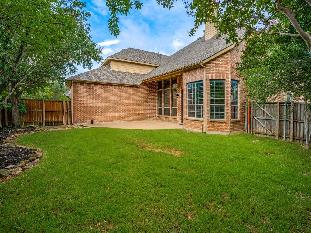 1908 Bordeaux Court Allen, TX 75002 - Photo 25 of 28 a front view of a house with a yard and porch