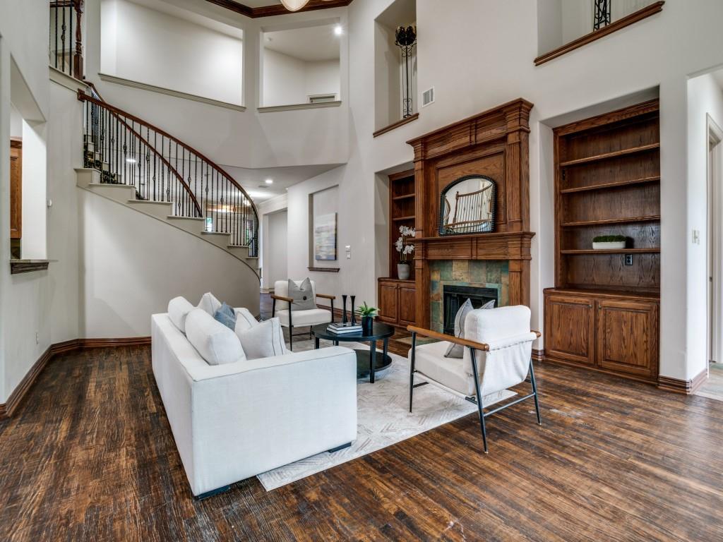 1908 Bordeaux Court Allen, TX 75002 - Photo 6 of 28 a living room with furniture a fireplace and a flat screen tv