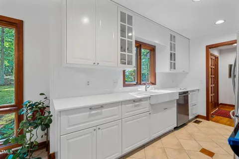 a bathroom with a shower a toilet and a sink