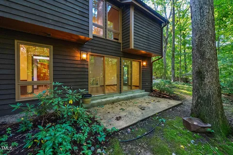 a view of balcony with wooden floor